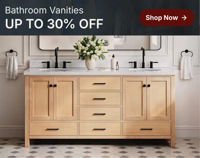 White oak vanity with shaker doors and marble top, styled with round mirror and greenery in a bright bathroom.
