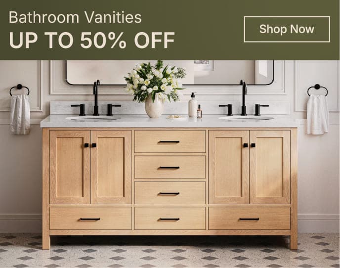 White oak vanity with shaker doors and marble top, styled with round mirror and greenery in a bright bathroom.