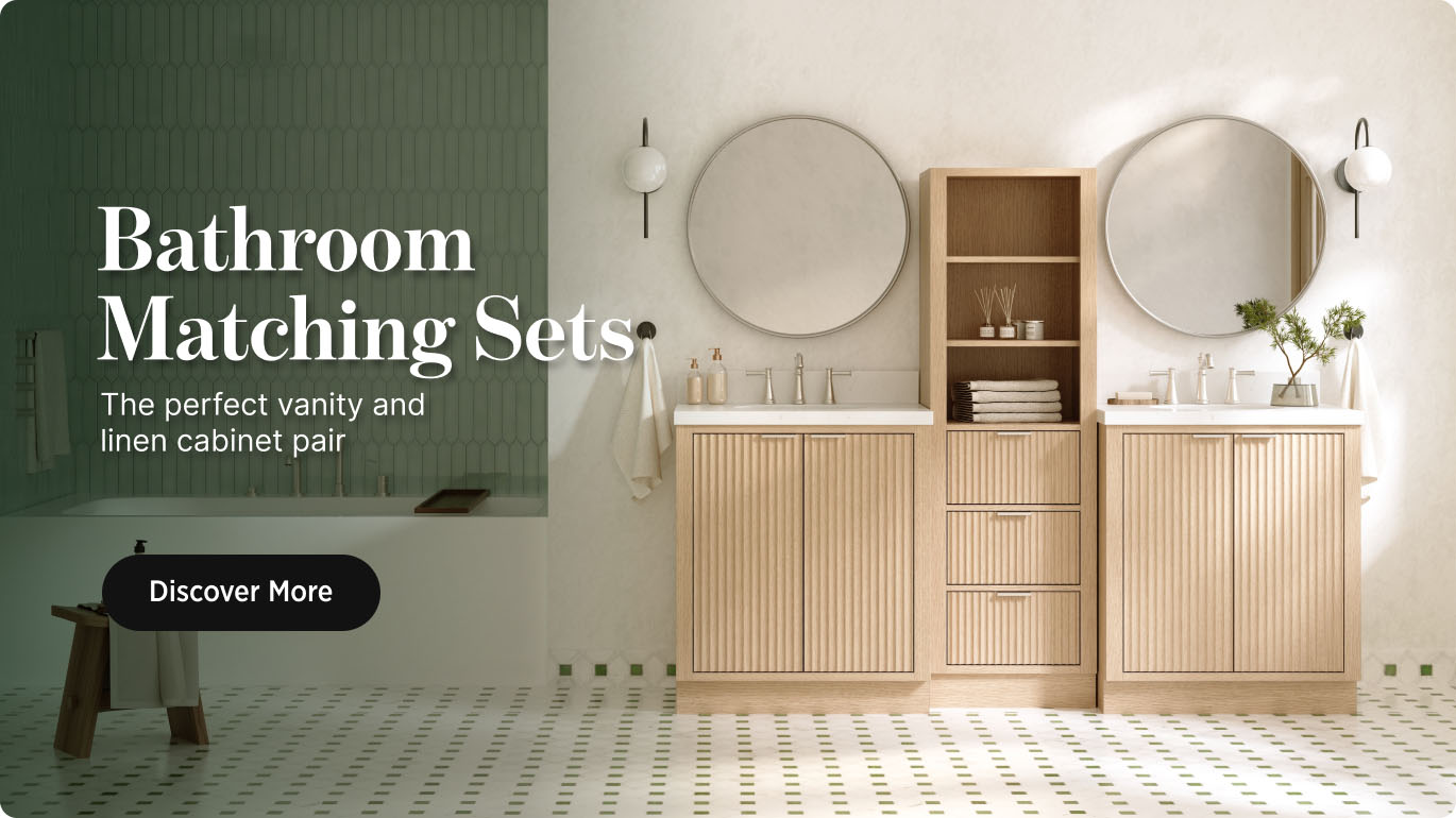 Bathroom Matching Sets Natural oak bathroom vanity and matching linen cabinet with round mirrors, styled against a green wall with soft lighting