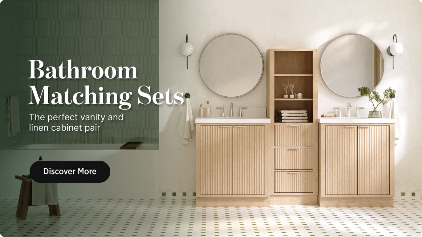 Bathroom Matching Sets Natural oak bathroom vanity and matching linen cabinet with round mirrors, styled against a green wall with soft lighting