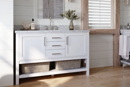 White vanity with open bottom shelf and basket storage, styled with marble top, gold faucet, and wood-accented wall.