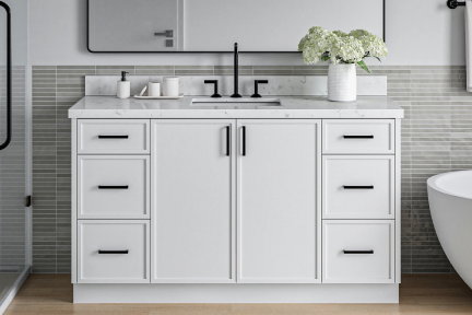 White double-sink vanity with black hardware and marble top, styled with grey tile wall and freestanding tub.